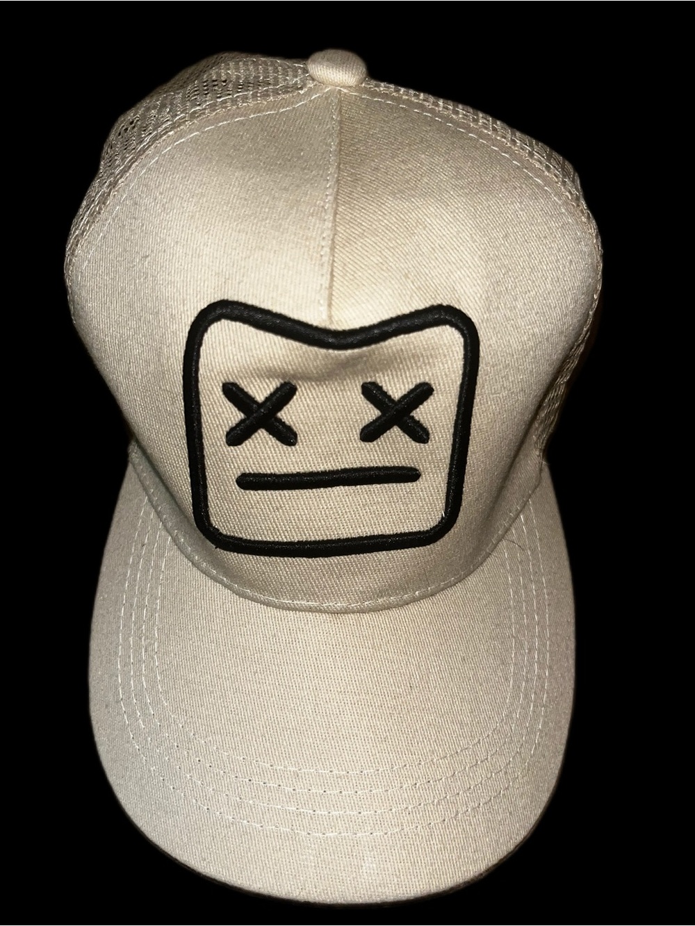 KAWS Beige Trucker Cap with Black Embroidered Face